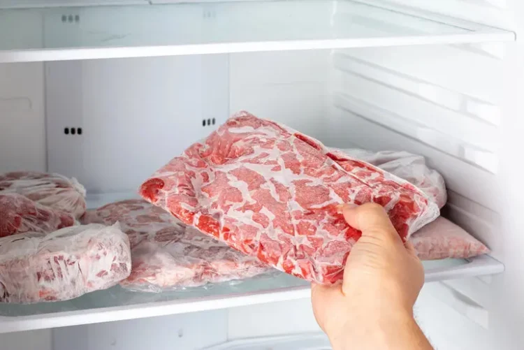 Fresh beef cuts stored in a refrigerator for proper home storage.