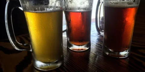 After the Taproom: A Responsible Wind-Down for Washington Beer Fans Three beer glasses on a wooden table.