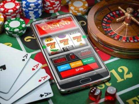 From Classic Reels to Modern Formats: The Evolution of the Best Online Slots An online slot game on a mobile phone with cards and poker chips nearby.