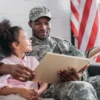 The Four Army Mathematicians Who Worked Out Blackjack Strategy African American male reading a book sitting beside his daughter.
