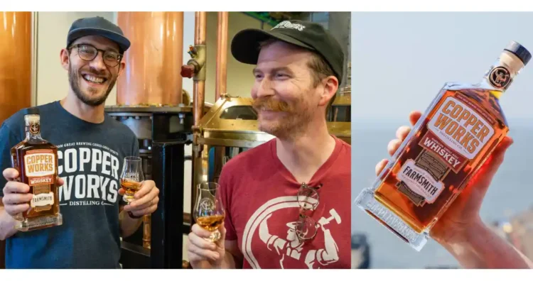 Two men sharing whiskey and hoisting a bottle