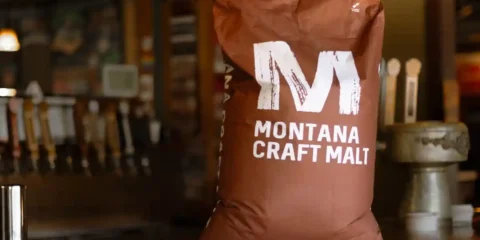 A bag of malted barley, brown with white letters