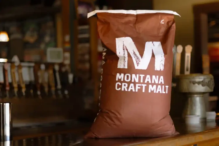 A bag of malted barley, brown with white letters