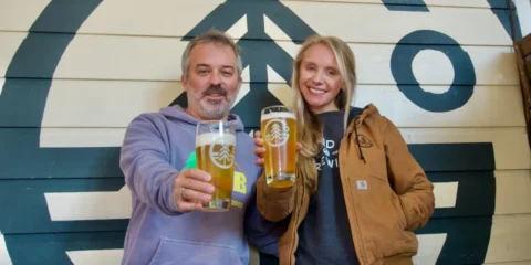 Grand Fir Brewing Opening Second Location in Damascus, Oregon Two people hoisting pints of beer