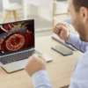 5 Mistakes to Avoid When Playing Live Roulette Online for the First Time Man playing live online roulette while poker chips on the table reacts joyfully.